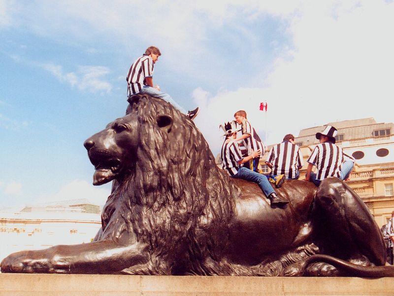 Soccer Fans On Trafalgar Square Lion